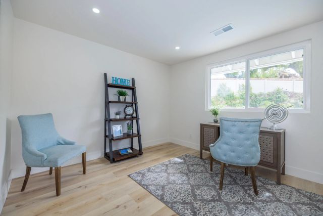 a dining room with furniture and wooden floor