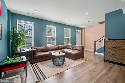 a living room with furniture and a gate