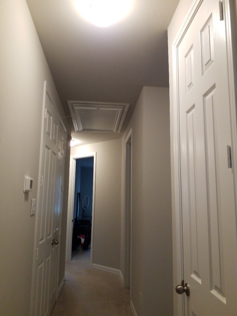 9406 Caddo Ridge Lane Cypress, TX 77433 - Photo 9 of 16 a view of a hallway with closet and mirror