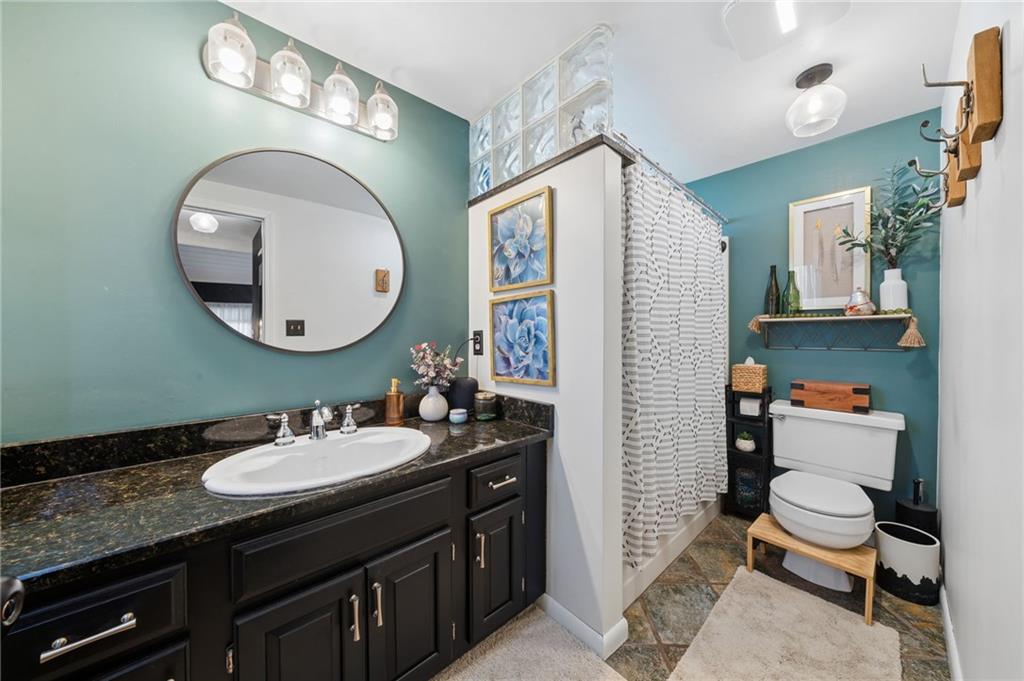 2187 Elizabeth Court Export, PA 15632 - Photo 19 of 43 a bathroom with a sink a toilet and a mirror
