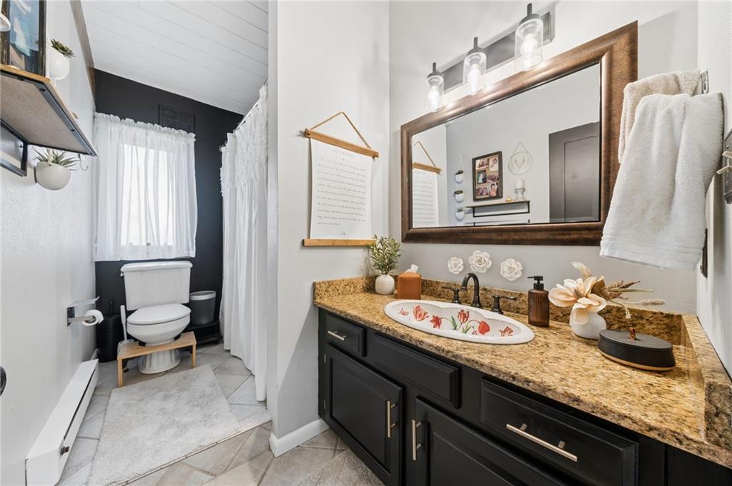 2187 Elizabeth Court Export, PA 15632 - Photo 25 of 43 a spacious bathroom with a granite countertop sink and a mirror