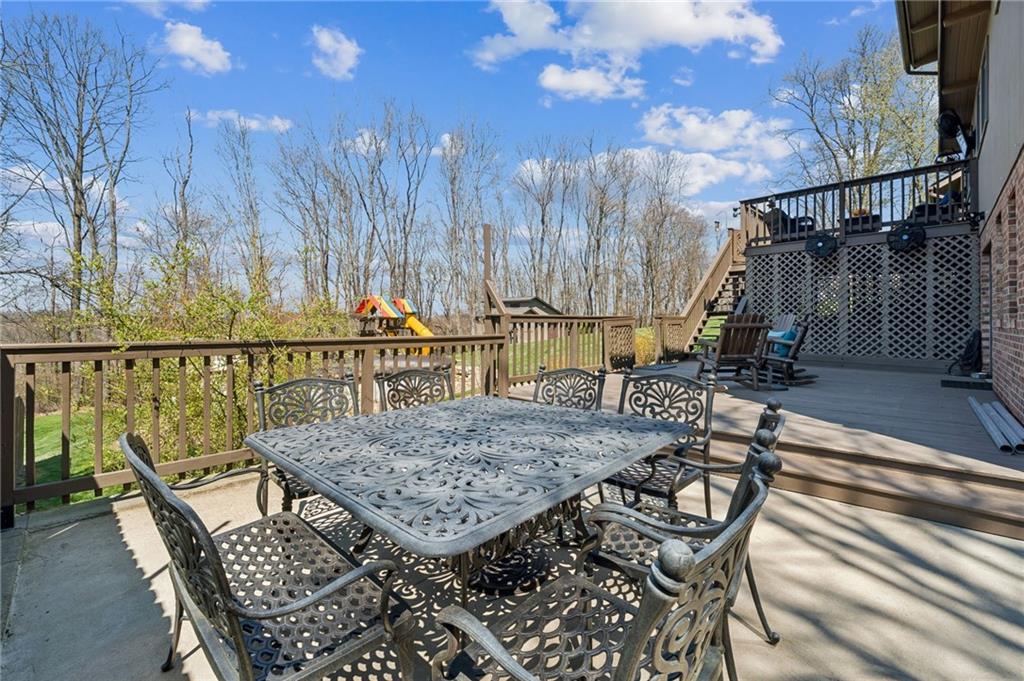 2187 Elizabeth Court Export, PA 15632 - Photo 36 of 43 a view of a roof deck with table and chairs with wooden floor