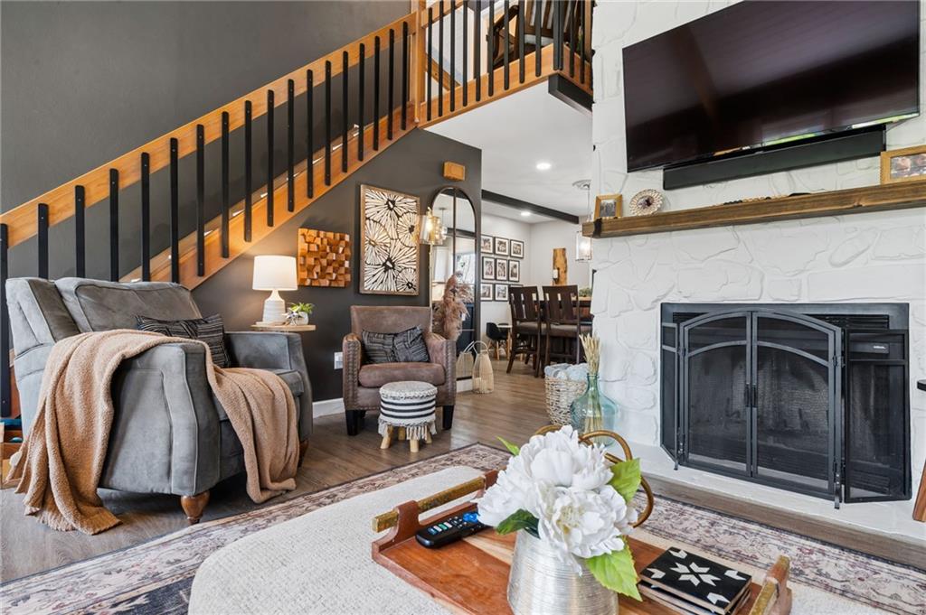 2187 Elizabeth Court Export, PA 15632 - Photo 7 of 43 a hallway with a couch and a flat screen tv