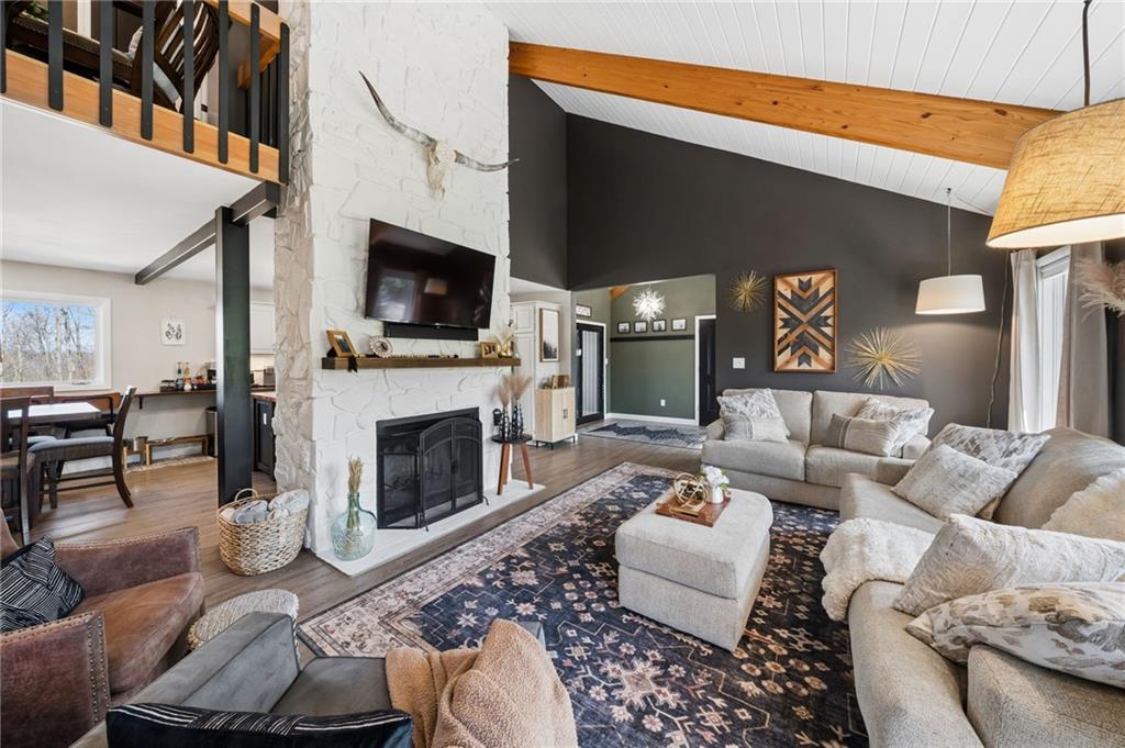 2187 Elizabeth Court Export, PA 15632 - Photo 9 of 43 a living room with furniture a flat screen tv and a fireplace