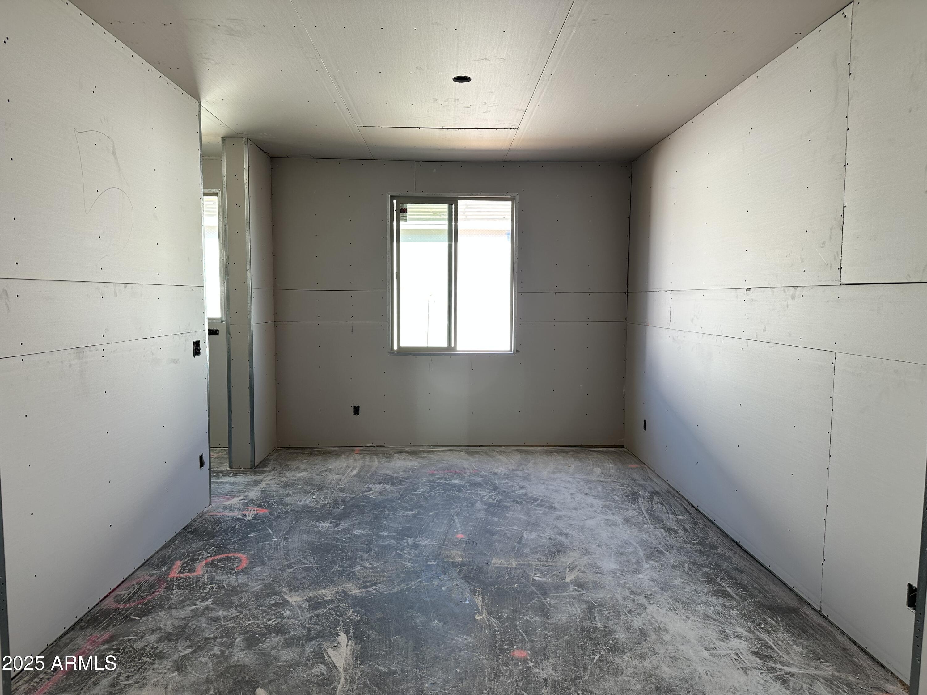 5532 West Hopi Trail Laveen, AZ 85339 - Photo 3 of 26 an empty room with windows