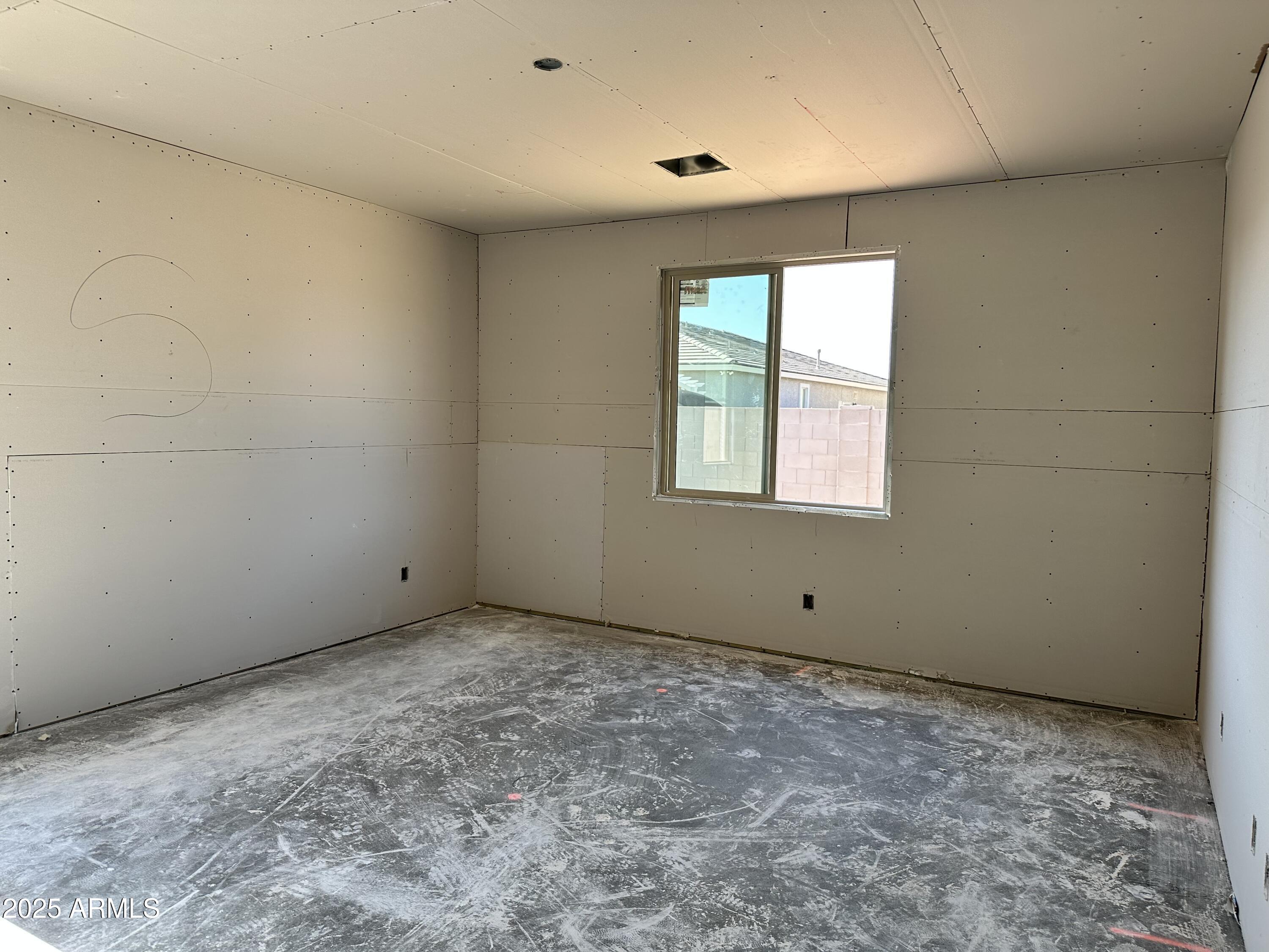 5532 West Hopi Trail Laveen, AZ 85339 - Photo 10 of 26 a view of an empty room with a window