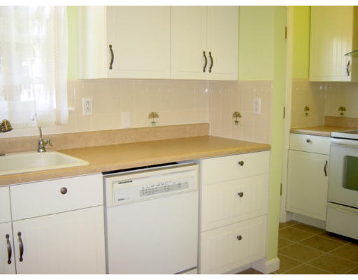 4 Douglas Road Belmont, MA 02478 - Photo 4 of 9 a kitchen with a sink and cabinets