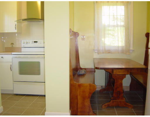 4 Douglas Road Belmont, MA 02478 - Photo 7 of 9 a kitchen with a sink cabinets and a table