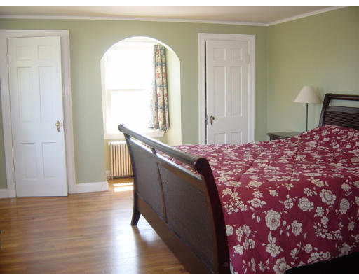 4 Douglas Road Belmont, MA 02478 - Photo 8 of 9 a bed room with a bed