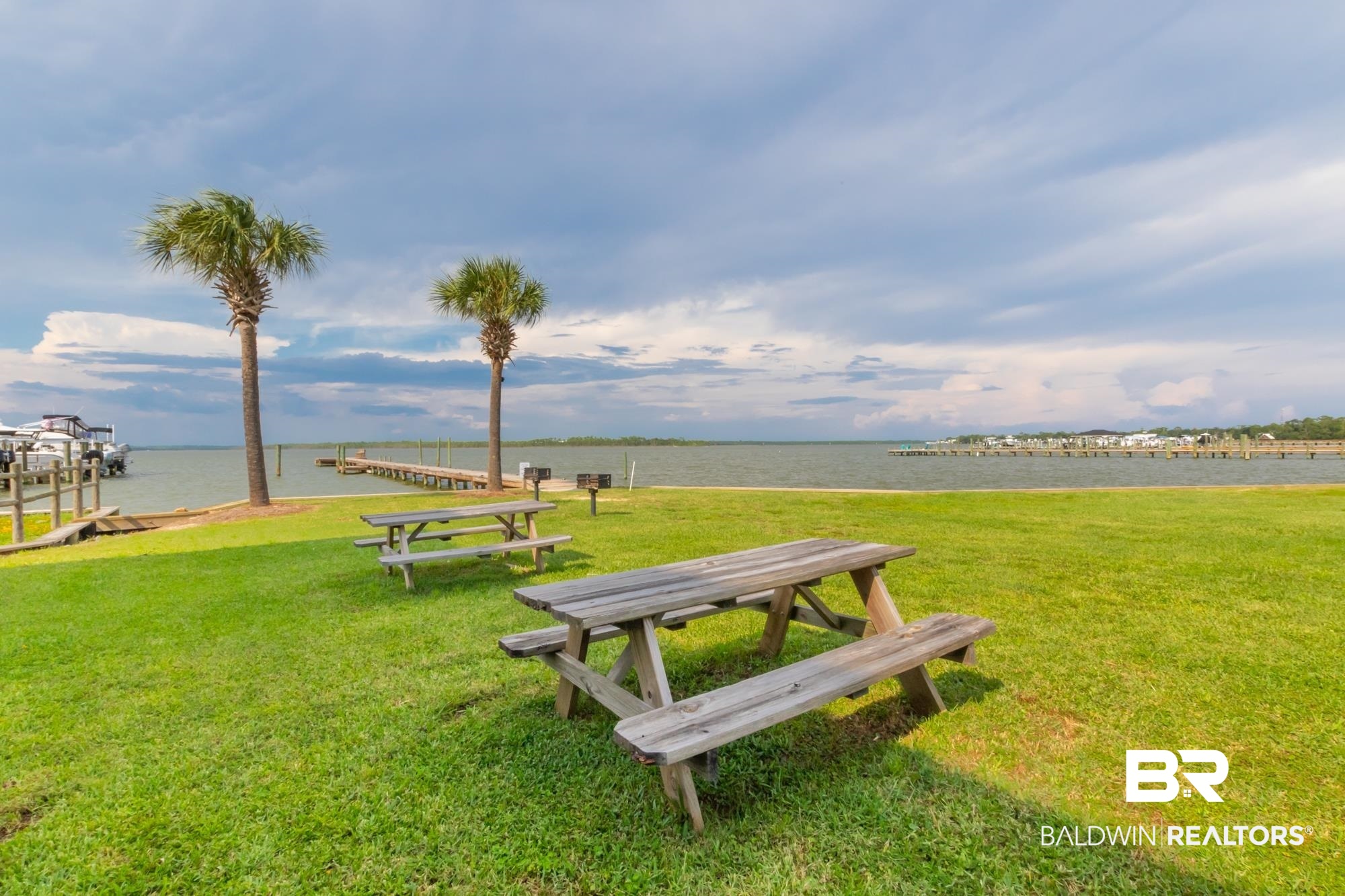 25925 -C Canal Road, Unit 203 Orange Beach, AL 36561 - Photo 48 of 57 Surrounding community featuring a water view, a lawn, and a dock