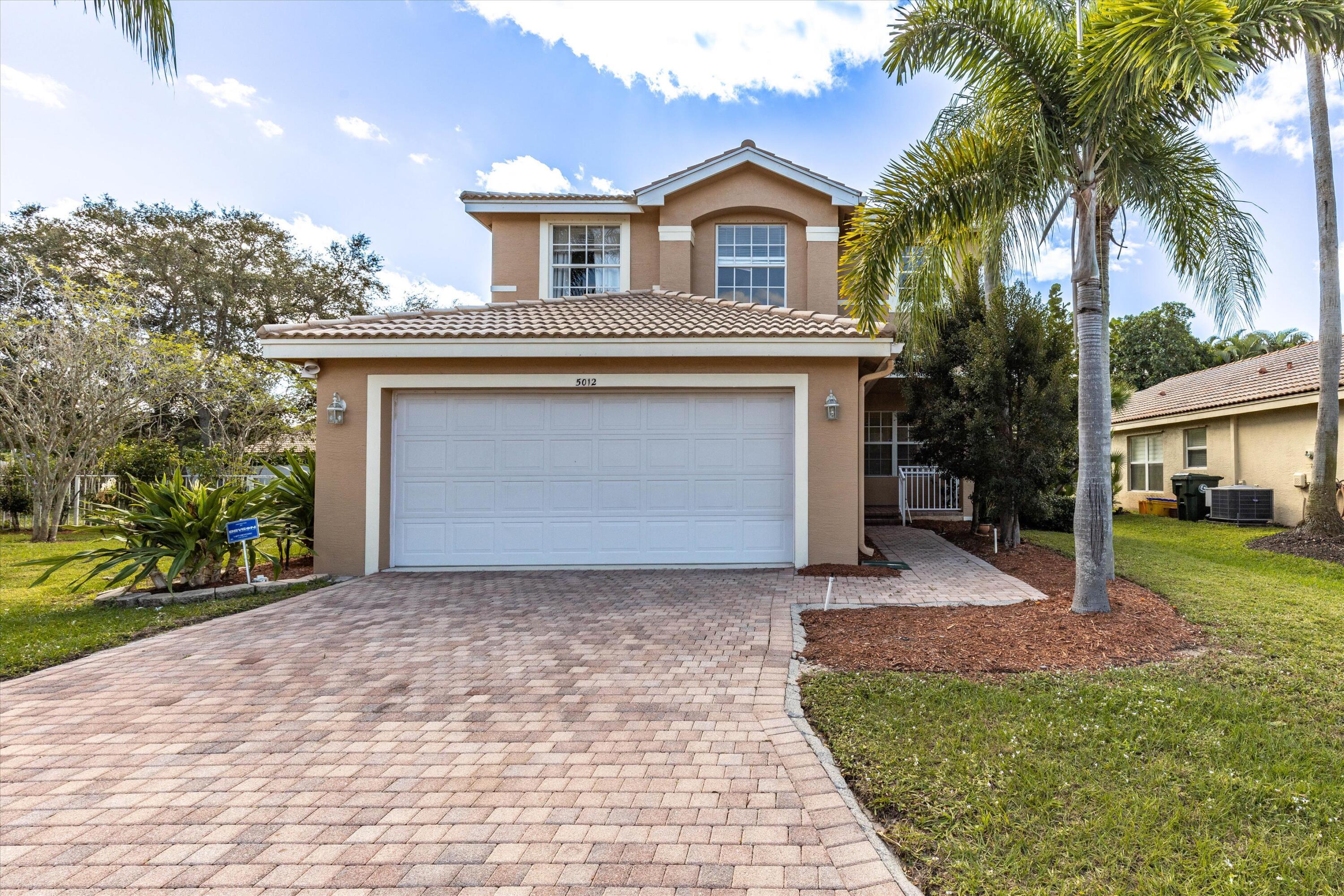 5012 Solar Point Drive Greenacres, FL 33463 - Photo 3 of 39 f8_5012SolarPointDr_001