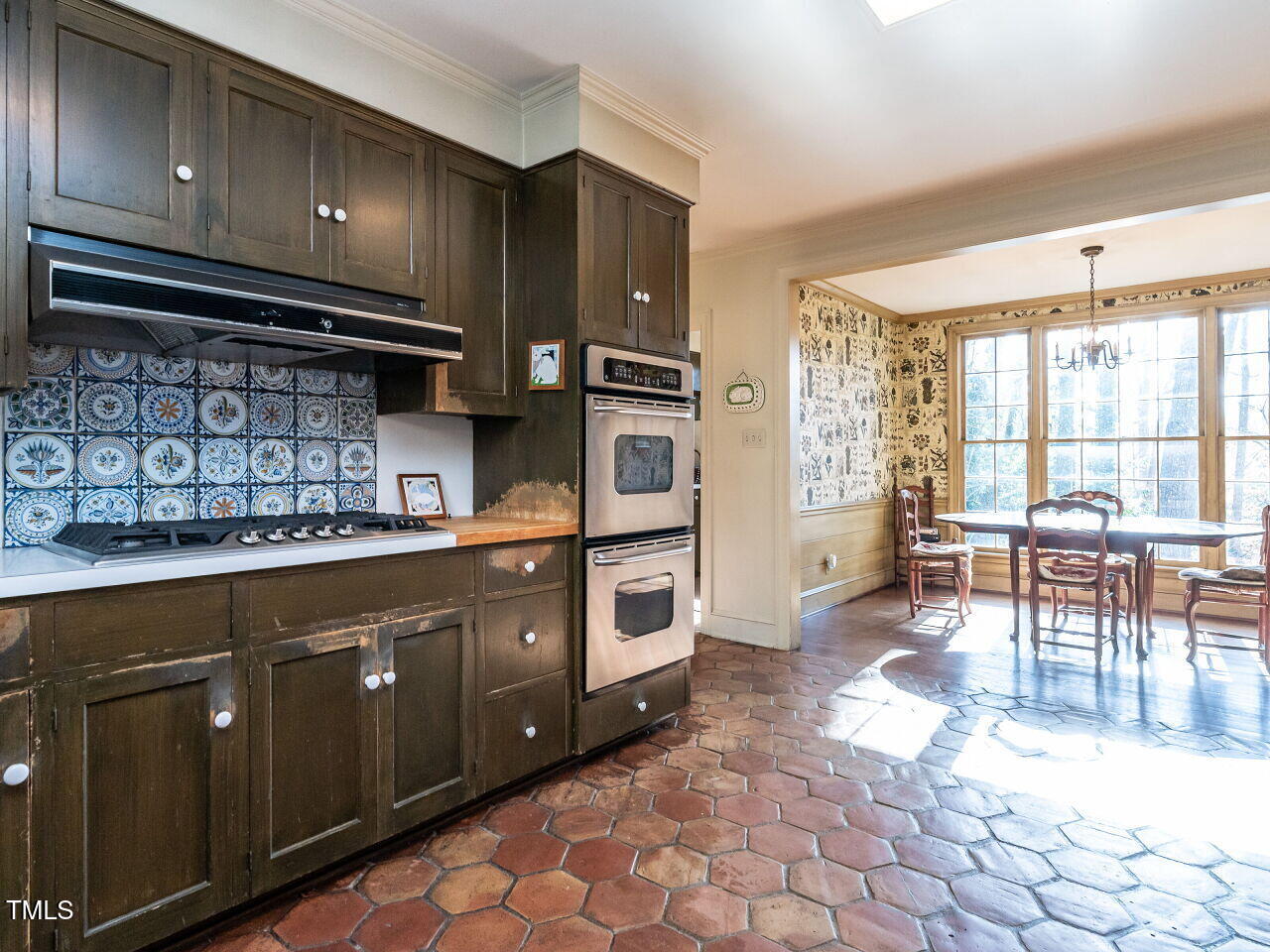1016 Marlowe Road Raleigh, NC 27609 - Photo 16 of 33 a kitchen with stainless steel appliances granite countertop a stove a sink and a microwave