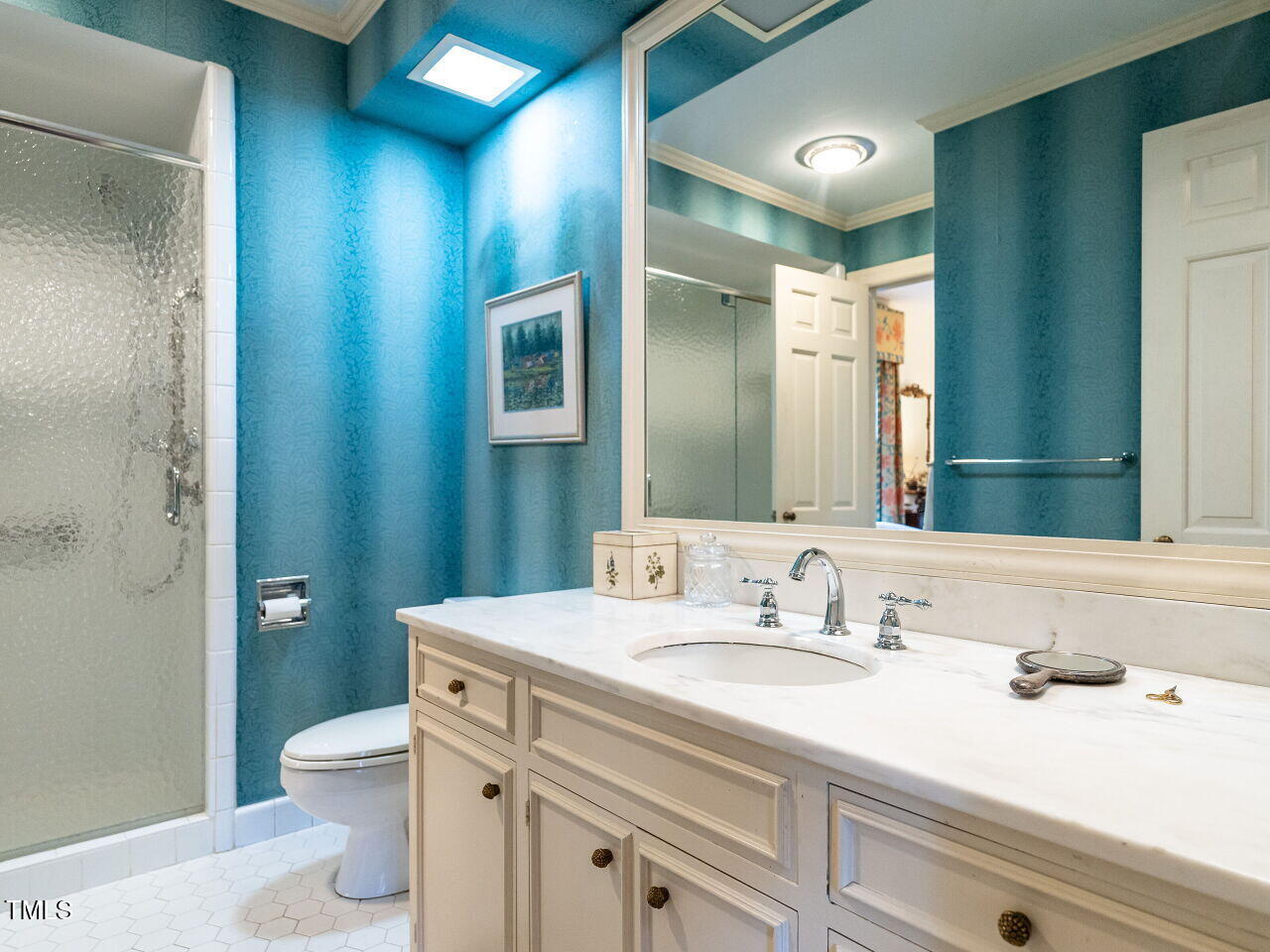 1016 Marlowe Road Raleigh, NC 27609 - Photo 23 of 33 a bathroom with a granite countertop sink a toilet and a mirror