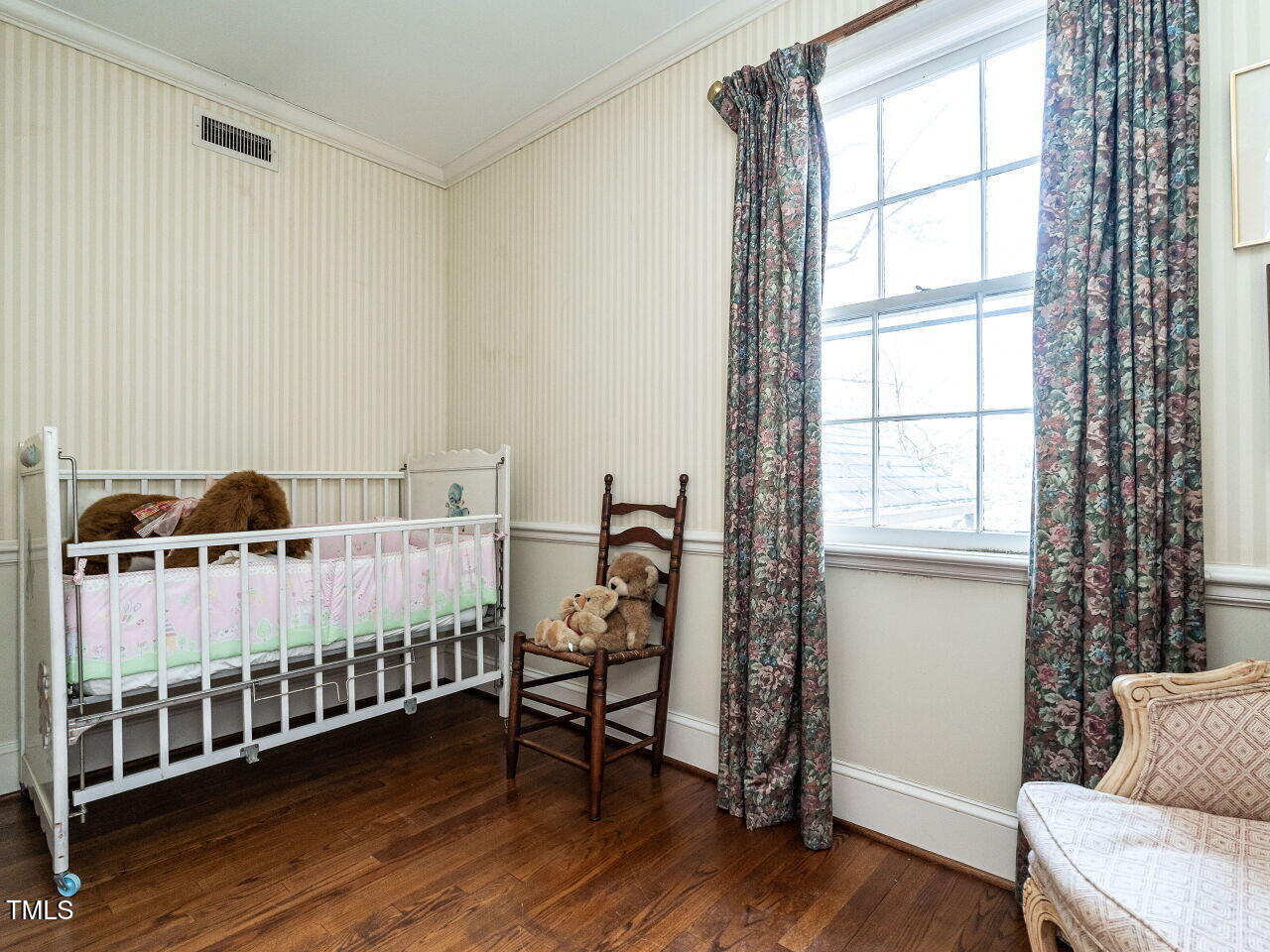 1016 Marlowe Road Raleigh, NC 27609 - Photo 24 of 33 a bed room with furniture and a window