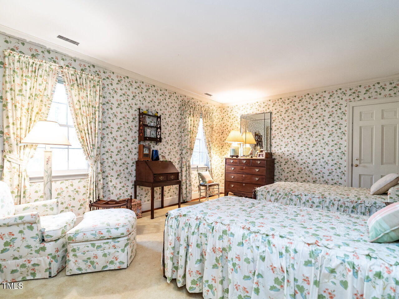 1016 Marlowe Road Raleigh, NC 27609 - Photo 25 of 33 a bedroom with a bed and a chandelier