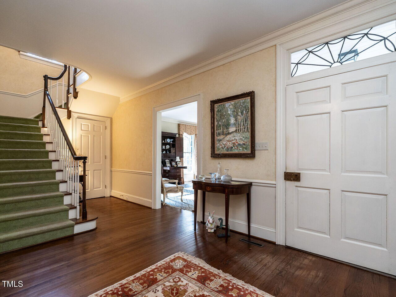1016 Marlowe Road Raleigh, NC 27609 - Photo 5 of 33 a view of a livingroom with wooden floor and stairs
