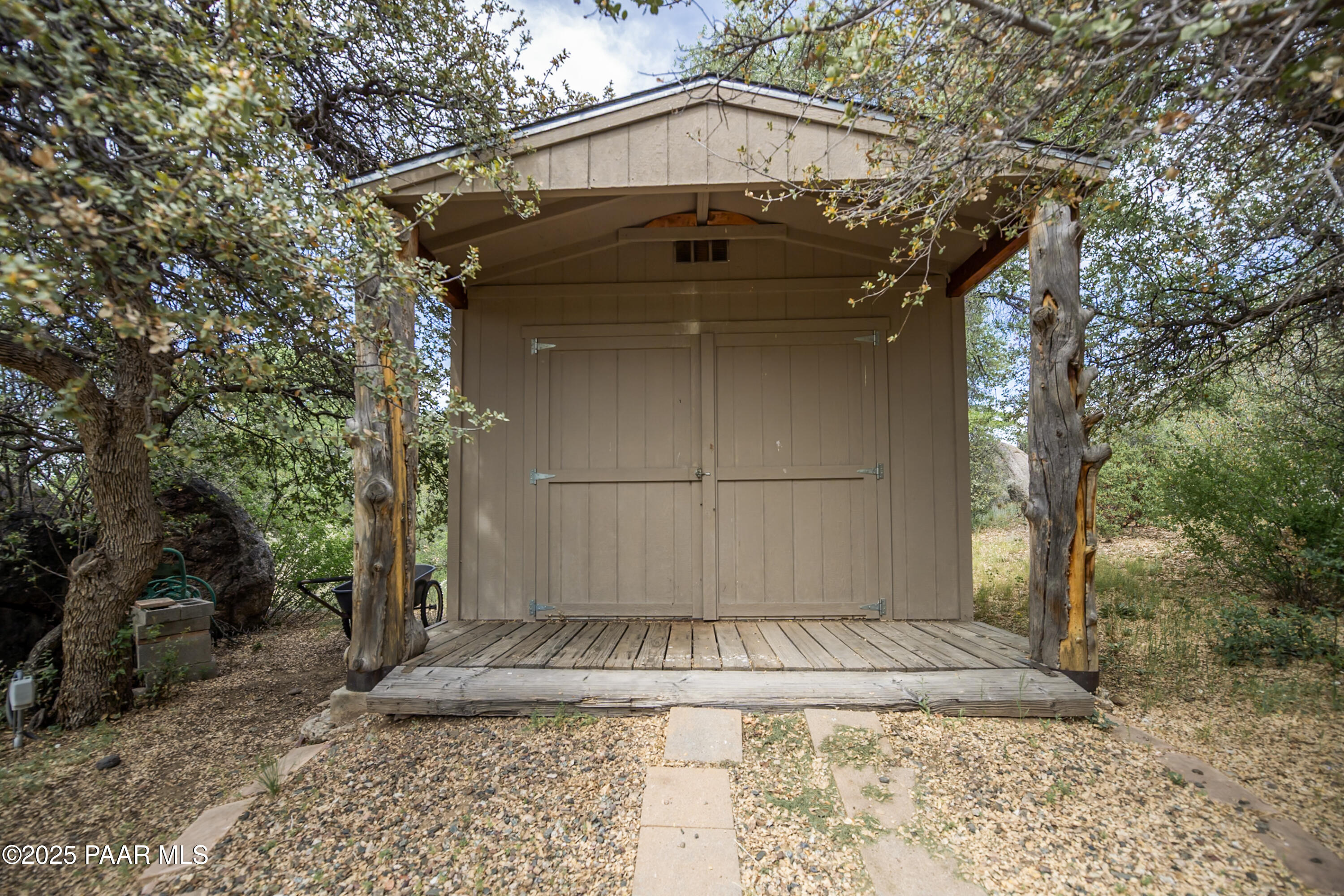 770 Grisby Road Skull Valley, AZ 86338 - Photo 47 of 58 a view of a house with a large tree