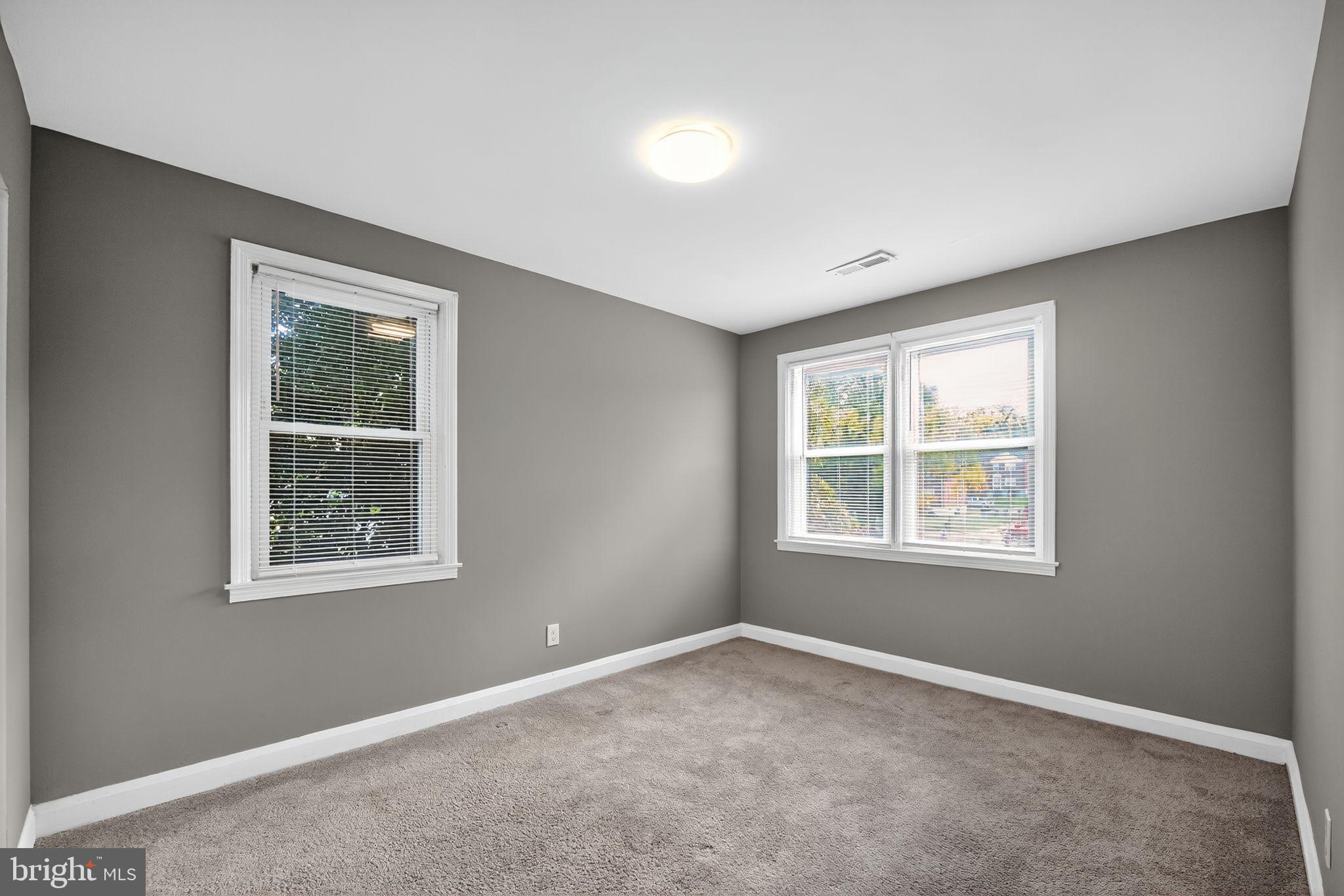 901 Kevin Road Baltimore, MD 21229 - Photo 6 of 31 a view of an empty room with a window