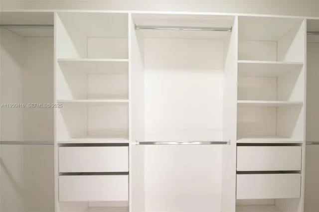 a view of an empty walk in closet
