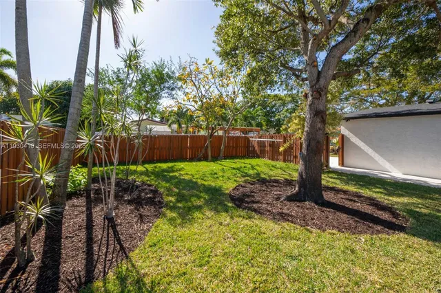 a backyard of a house with lots of green space
