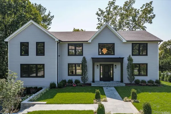 front view of a house with a yard