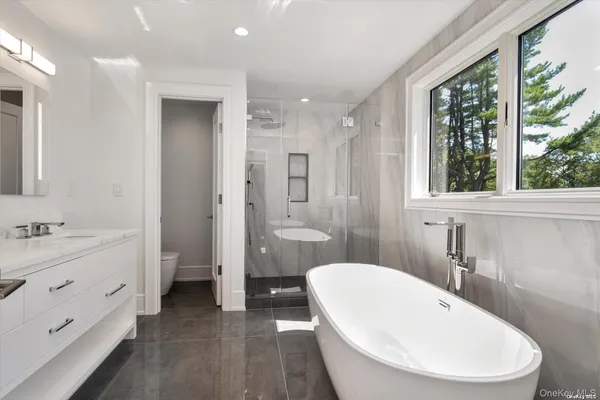 a bathroom with a toilet a sink and a bathtub