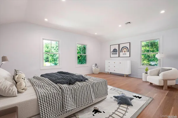 a bedroom with a bed and a couch