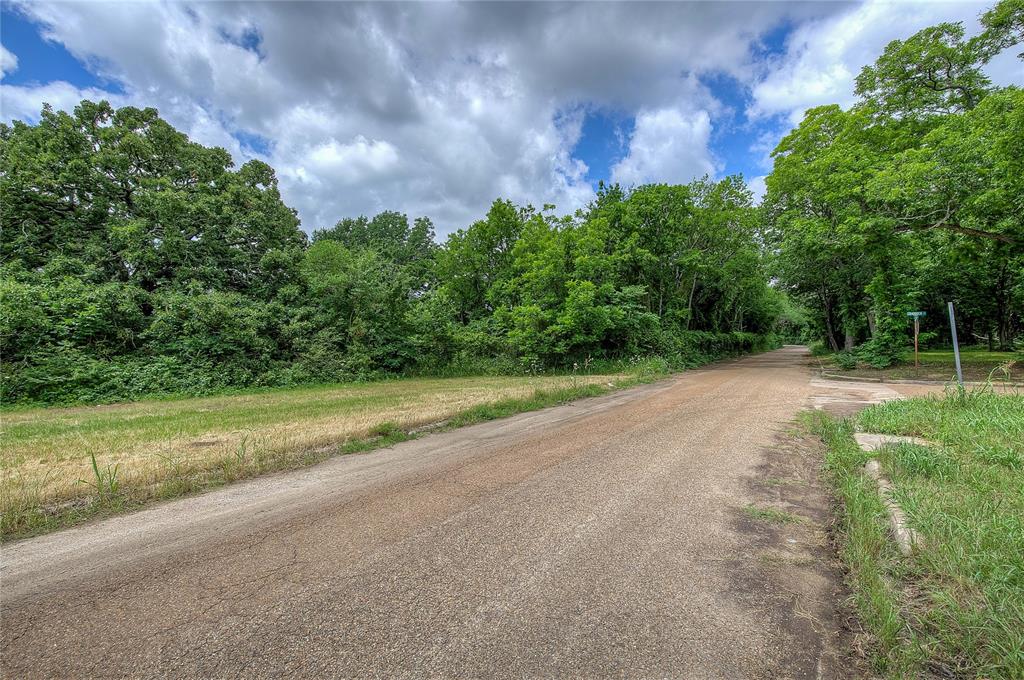 Tbd Sycamore Street Commerce, TX 75428 - Photo 9 of 11 a view of a field with trees in background