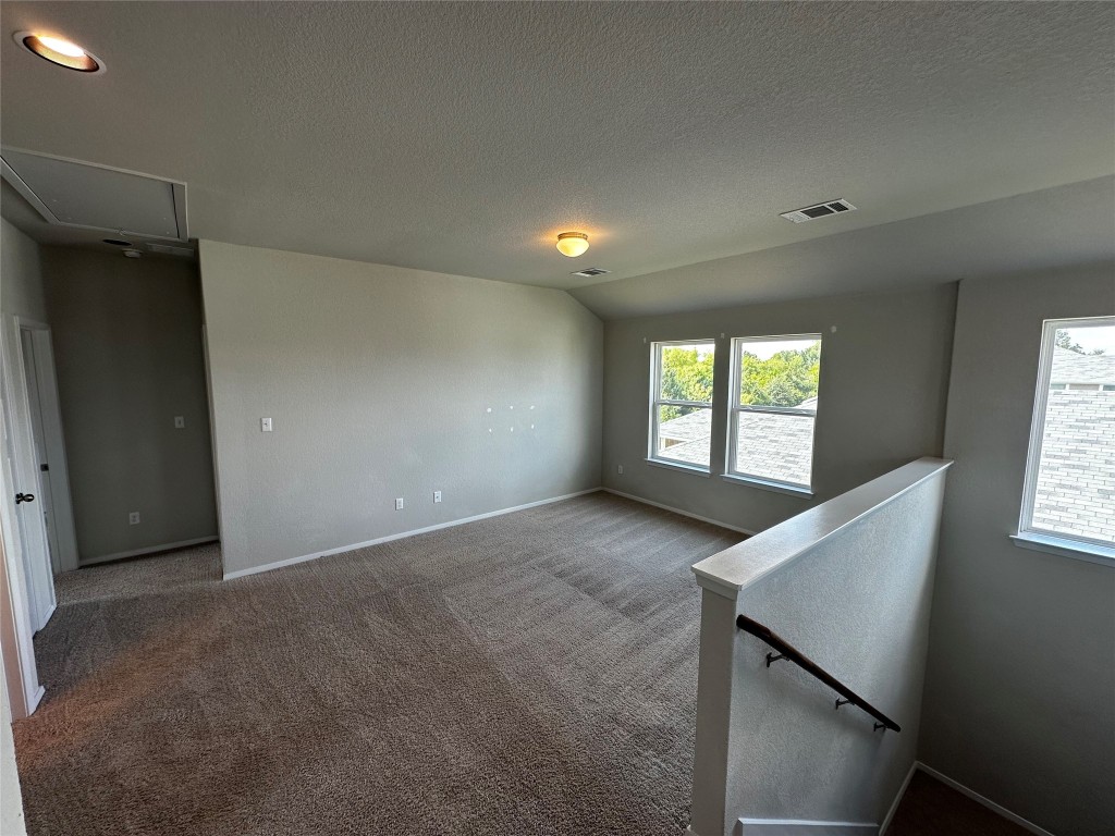 316 Insider Loop Elgin, TX 78621 - Photo 11 of 13 an empty room with windows