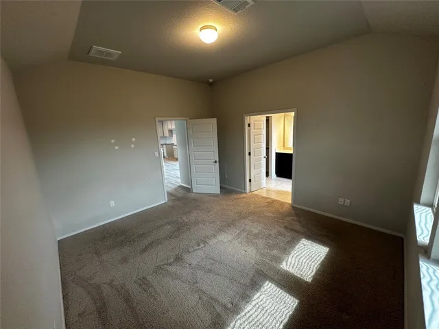 a view of an empty room and window