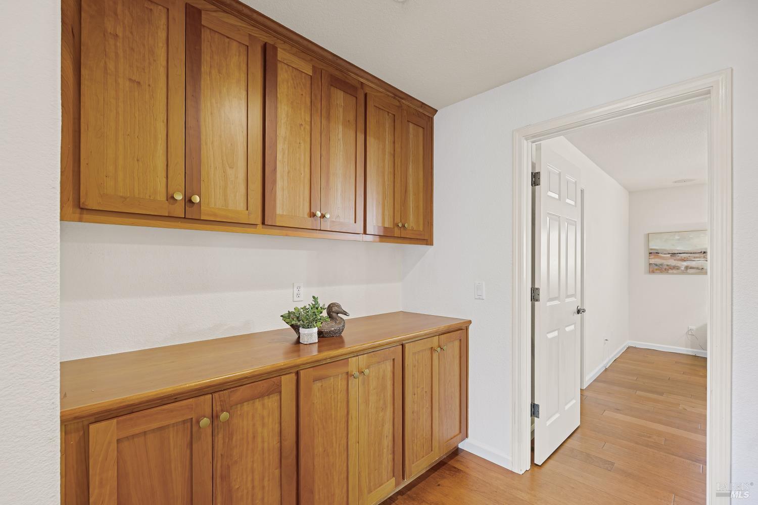 68 Pinheiro Circle Novato, CA 94945 - Photo 40 of 82 Thoughtfully designed built-in cabinetry provides an abundance of storage for linens, games, seasonal décor, or household essentials, helping keep the home organized and clutter-free.