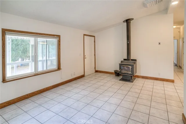 a view of a yard with plants and trees