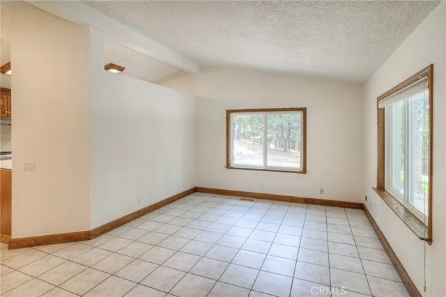 a kitchen with stainless steel appliances a refrigerator sink and cabinets