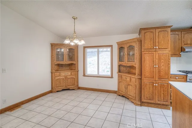 a kitchen with granite countertop cabinets and steel stainless steel appliances