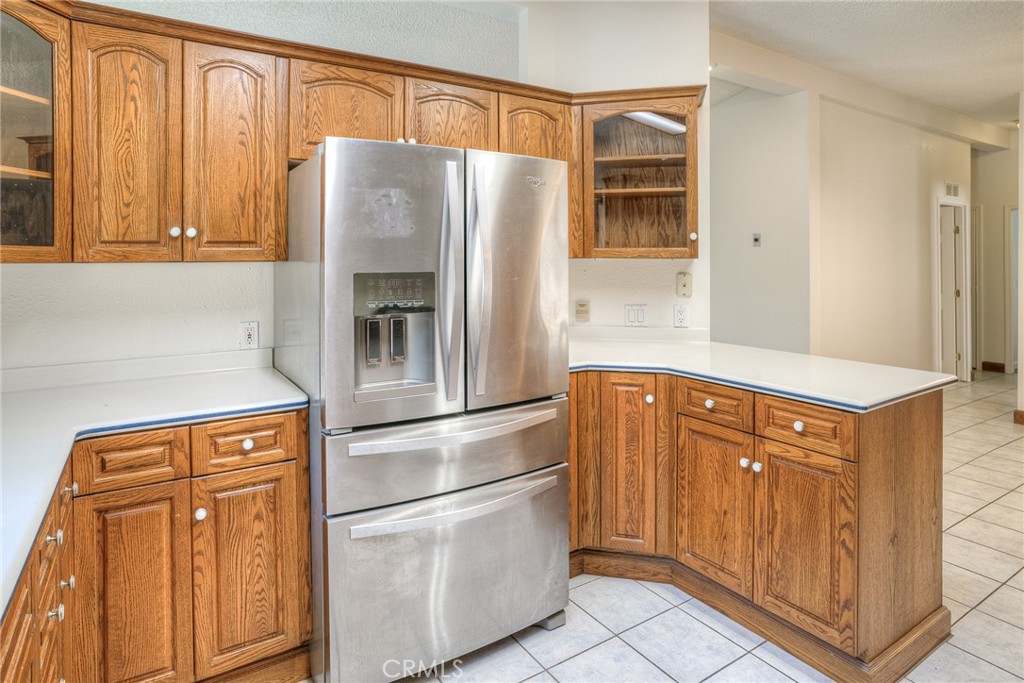 3635 Charqui Court Oroville, CA 95965 - Photo 22 of 75 a kitchen with stainless steel appliances granite countertop a refrigerator and a stove