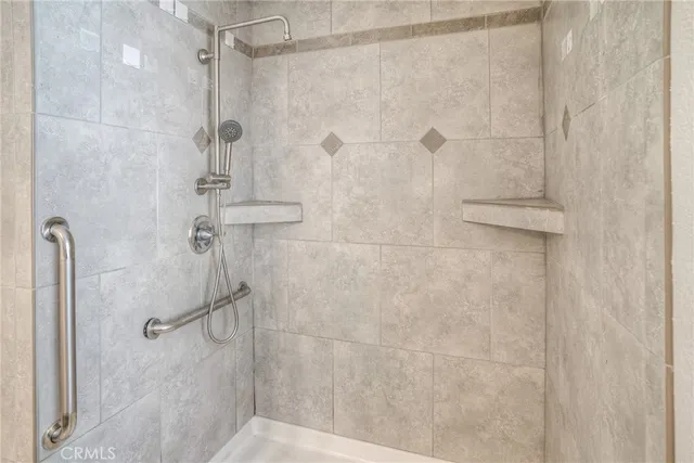 a view of a forest with trees in the background