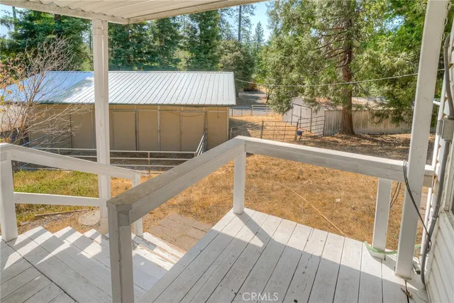 a backyard of a house with lots of trees