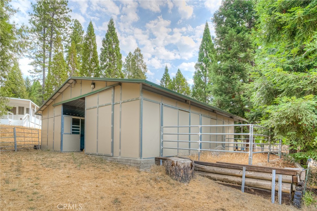 3635 Charqui Court Oroville, CA 95965 - Photo 43 of 75 a backyard of a house with large trees and table
