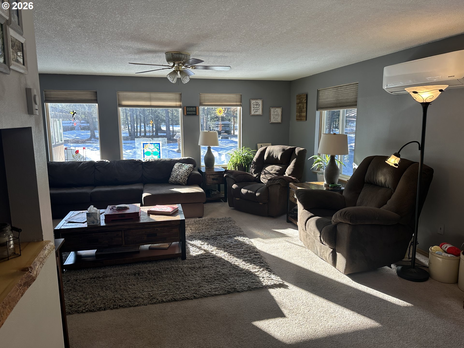 123977 Surveyor Road Crescent Lake, OR 97733 - Photo 11 of 46 a living room with furniture fireplace and a window