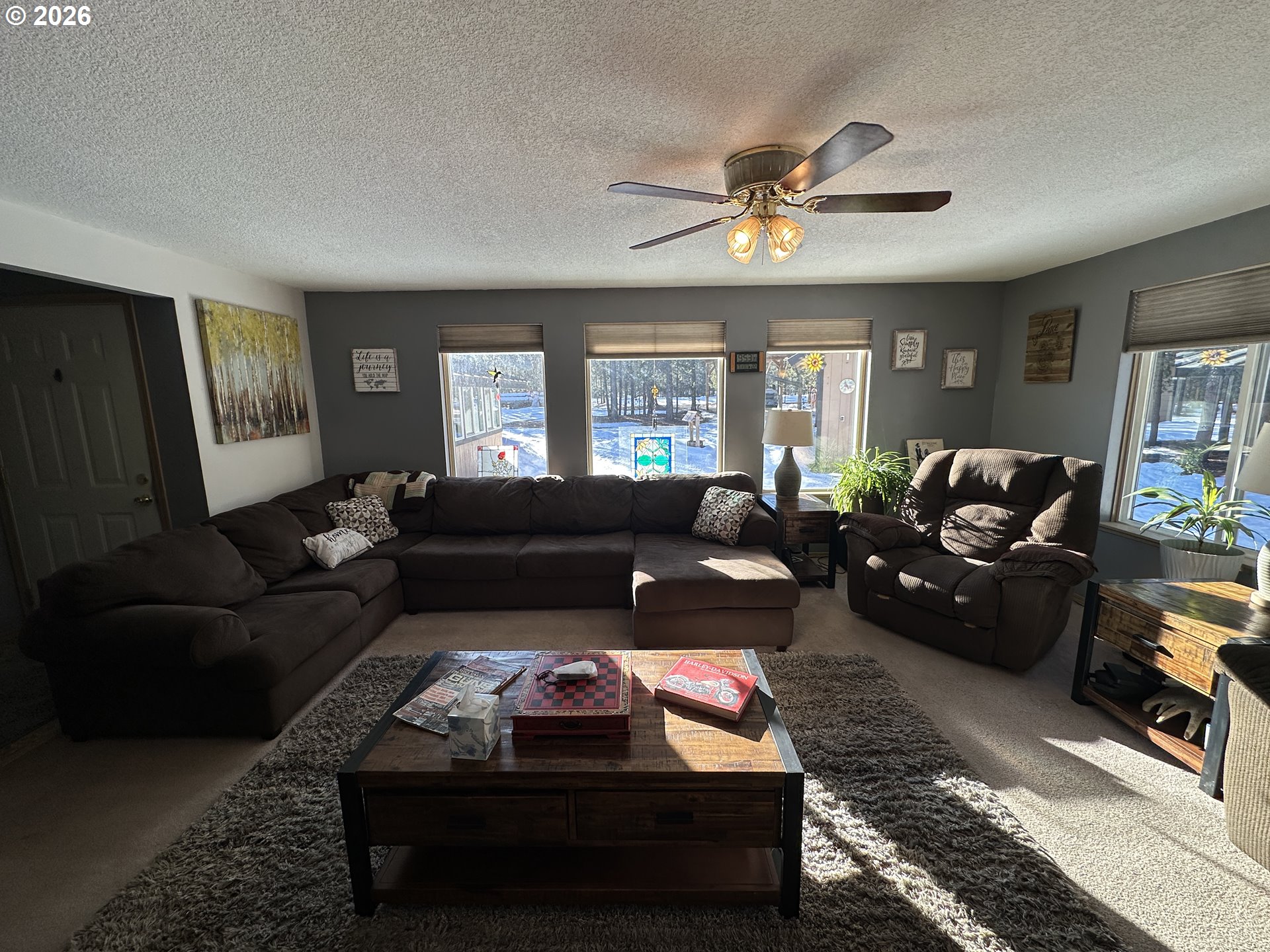 123977 Surveyor Road Crescent Lake, OR 97733 - Photo 12 of 46 a living room with furniture and a fireplace