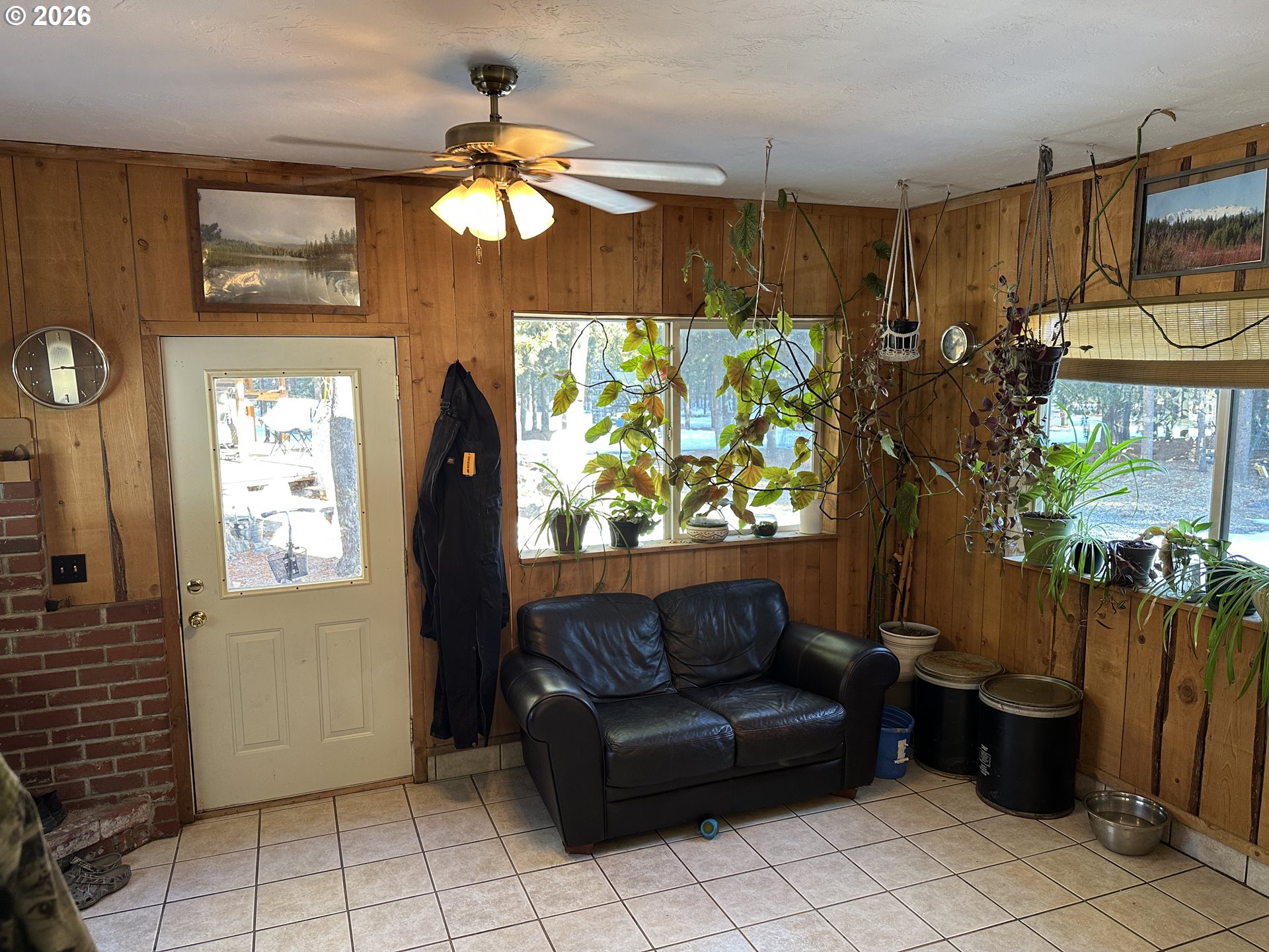123977 Surveyor Road Crescent Lake, OR 97733 - Photo 14 of 46 a living room with patio furniture and a chandelier