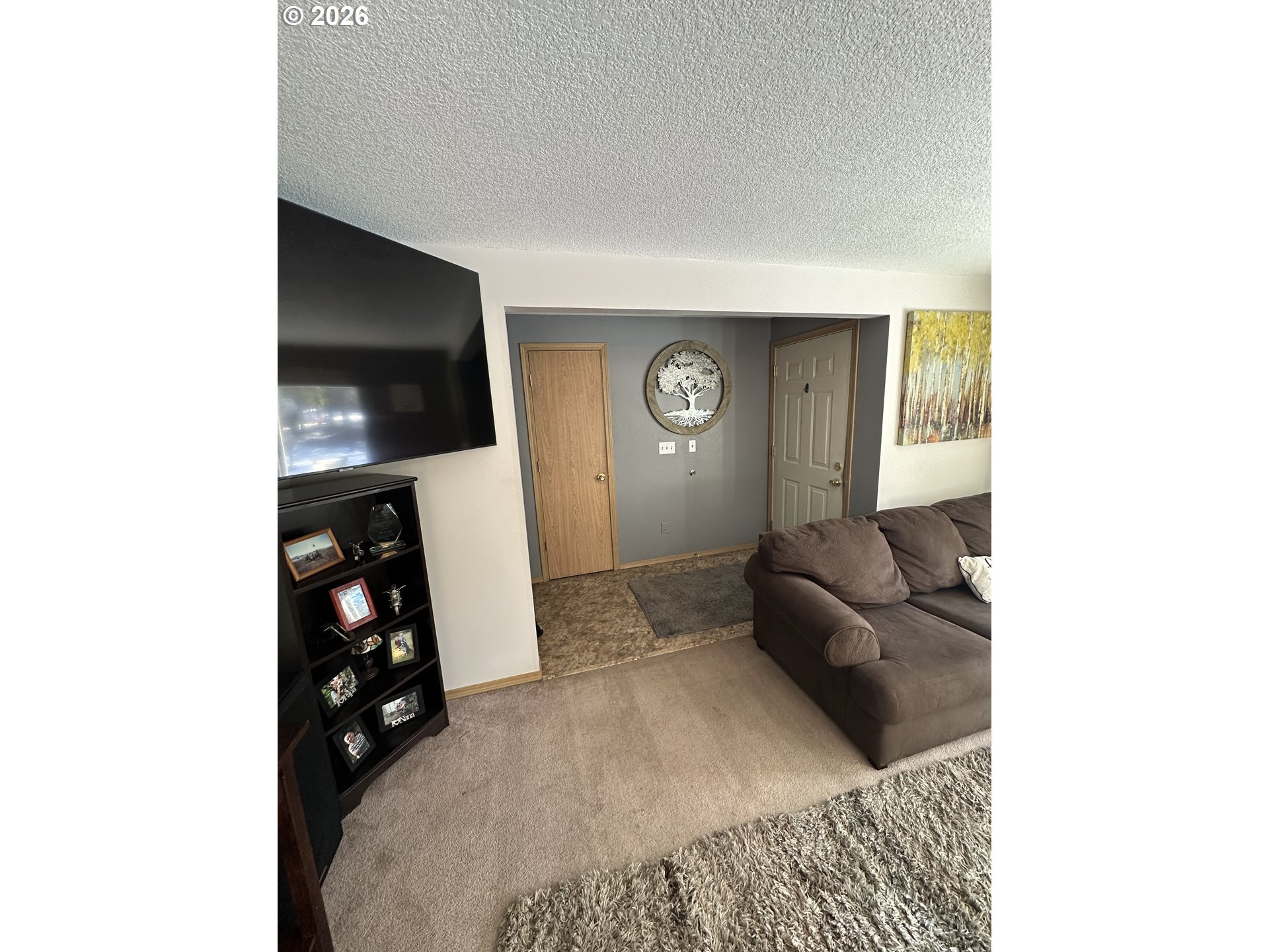 123977 Surveyor Road Crescent Lake, OR 97733 - Photo 27 of 46 a living room with furniture and a flat screen tv