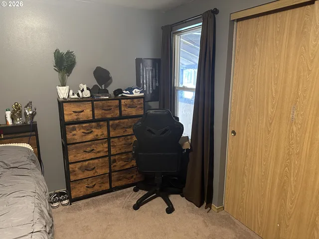 a view of a livingroom with furniture and windows