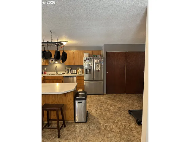a kitchen with a sink cabinets and appliances