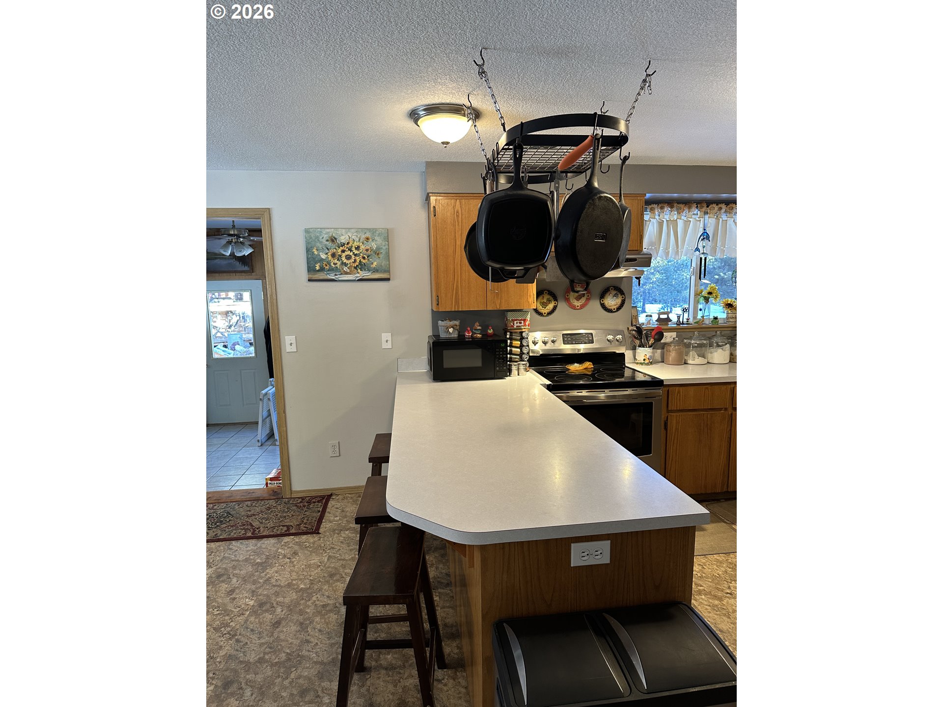 123977 Surveyor Road Crescent Lake, OR 97733 - Photo 7 of 46 a kitchen with a table and chairs