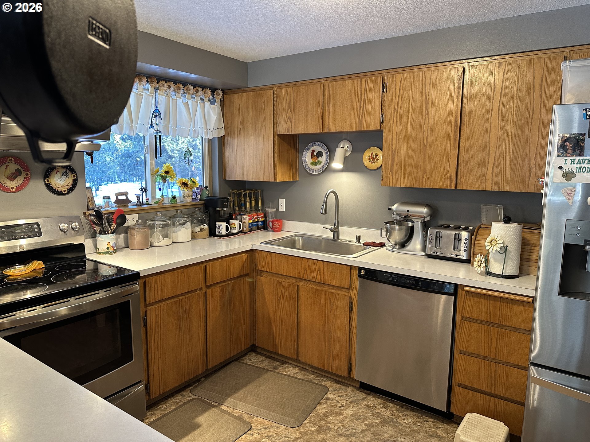 123977 Surveyor Road Crescent Lake, OR 97733 - Photo 8 of 46 a kitchen with a sink cabinets and window