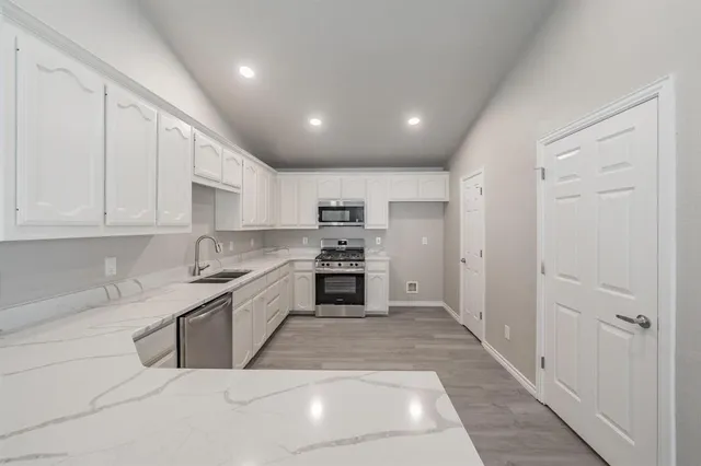 a large kitchen with cabinets