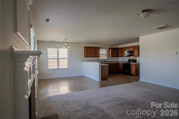 a view of a kitchen with a sink cabinets and a window