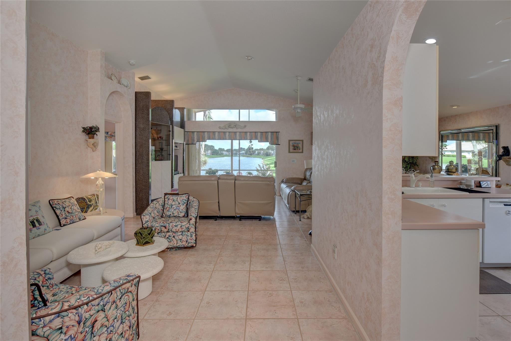 22918 Sterling Lakes Drive Boca Raton, FL 33433 - Photo 14 of 57 a living room with furniture and a large window