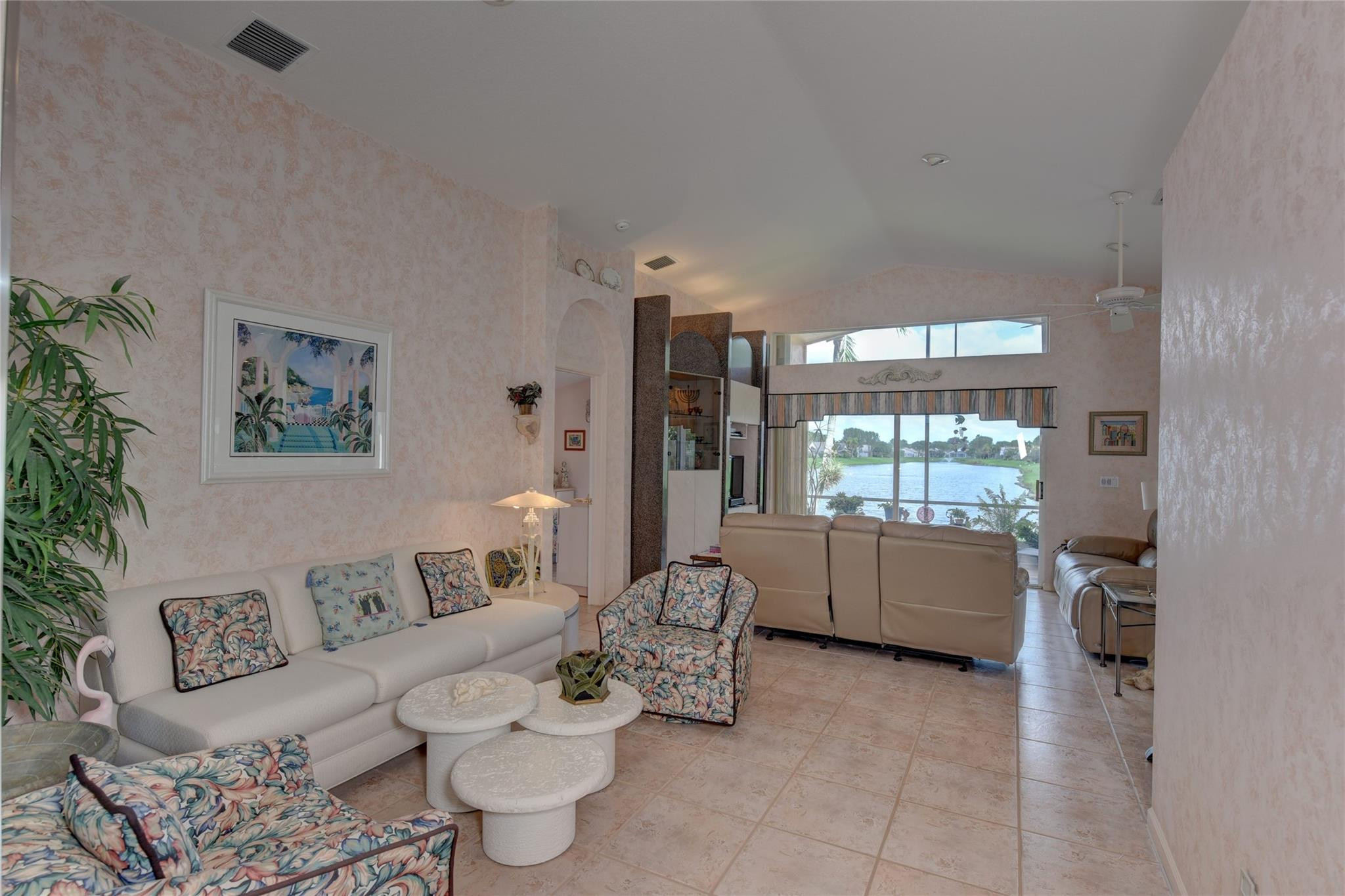 22918 Sterling Lakes Drive Boca Raton, FL 33433 - Photo 15 of 57 a living room with furniture and a large window